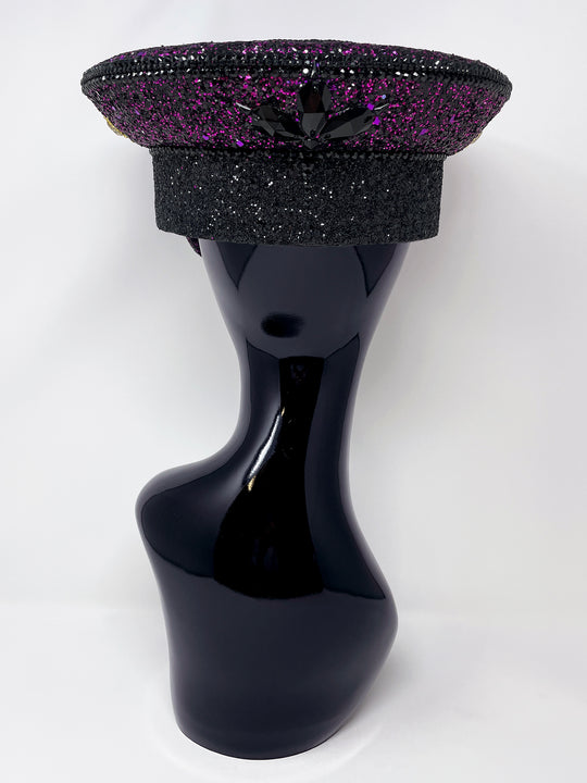 Hand embellished captain hat crafted from an authentic military hat, decorated with black and purple glitter, gold pearl like gems, rhinestones, crystals and geometric jewel detailing. Luxury stage, festival and statement fashion headwear. Handmade, rave, fully lined, high end fashion, costume hat