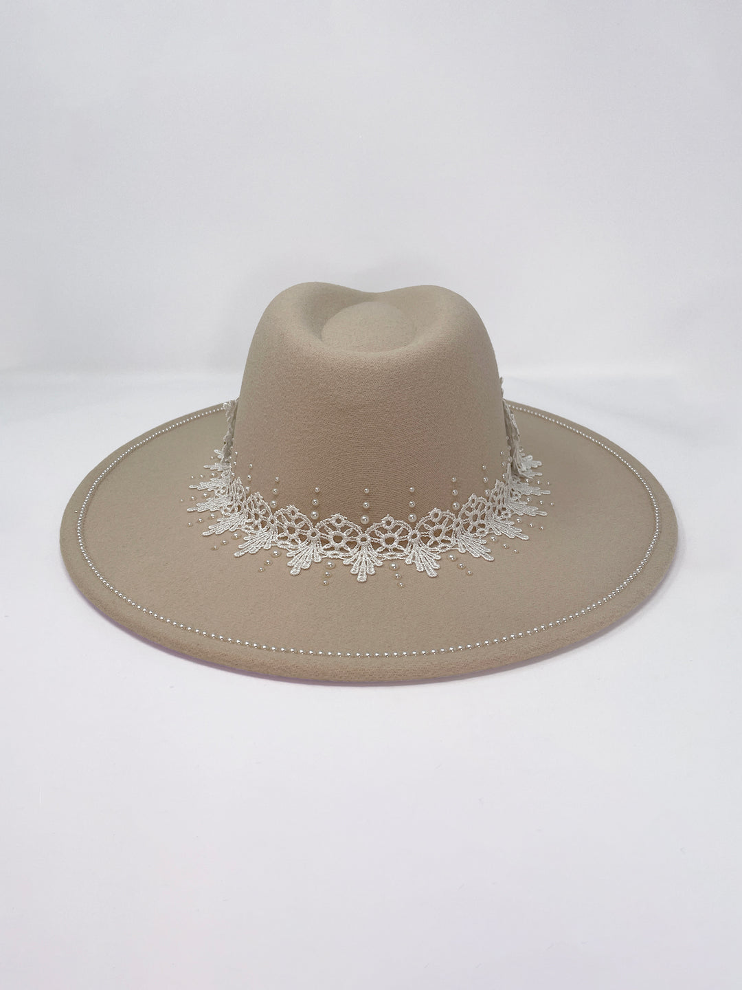 Beige fedora hat featuring interchangeable handmade lace bands with Velcro attachments. Includes three designs: “BRIDE” and “WIFEY” lettering embellished with crystals and pearls, and an elegant floral motif with lace, handmade  flowers and beaded details. A stylish 3-in-1 bridal accessory made in the UK. One size, wide brim fedora, luxury fedora, bride hat, wifey hat, floral hat, hen do
