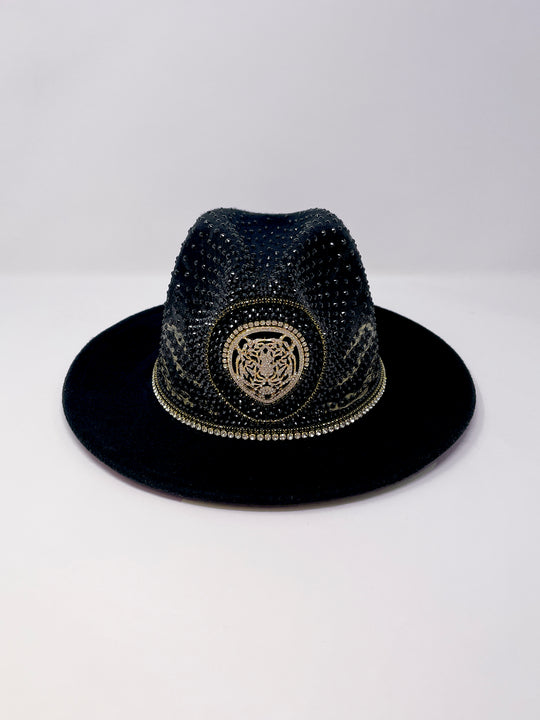 Short brim black fedora with black and metallic gold hand painted tiger print. Gold tiger motive centrepiece and crystal embellishments. Luxury fedora, rhinestones, statement fedora, unique headwear, animal print