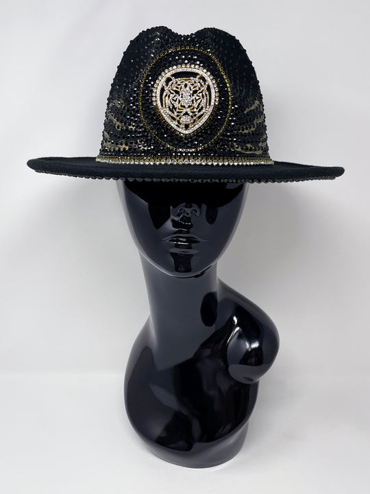 Short brim black fedora with black and metallic gold hand painted tiger print. Gold tiger motive centrepiece and crystal embellishments. Luxury fedora, rhinestones, statement fedora, unique headwear, animal print
