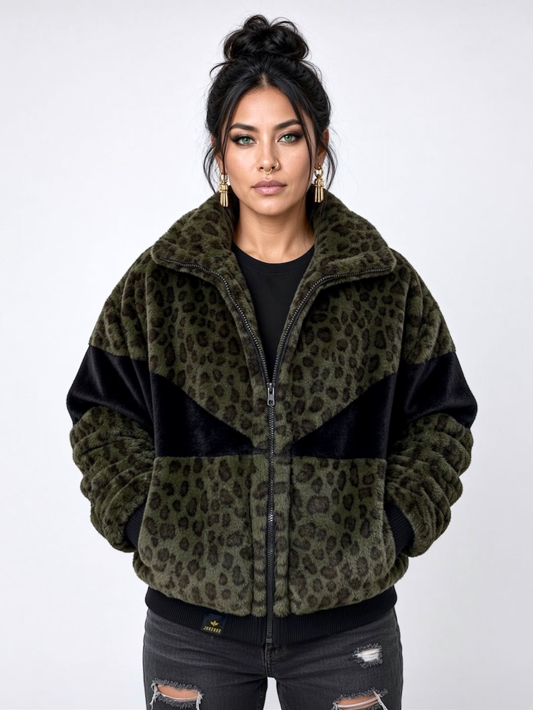 Forest green leopard print faux fur bomber jacket with contrasting black panels, oversized collar, front zip fastening, pockets and ribbed cuffs and ribbed waistband. Modelled with black ripped jeans. Plush faux fur, festival jacket, winter coat