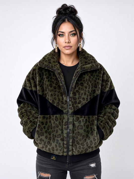 Forest green leopard print faux fur bomber jacket with contrasting black panels, oversized collar, front zip fastening, pockets and ribbed cuffs and ribbed waistband. Modelled with black ripped jeans. Plush faux fur, festival jacket, winter coat