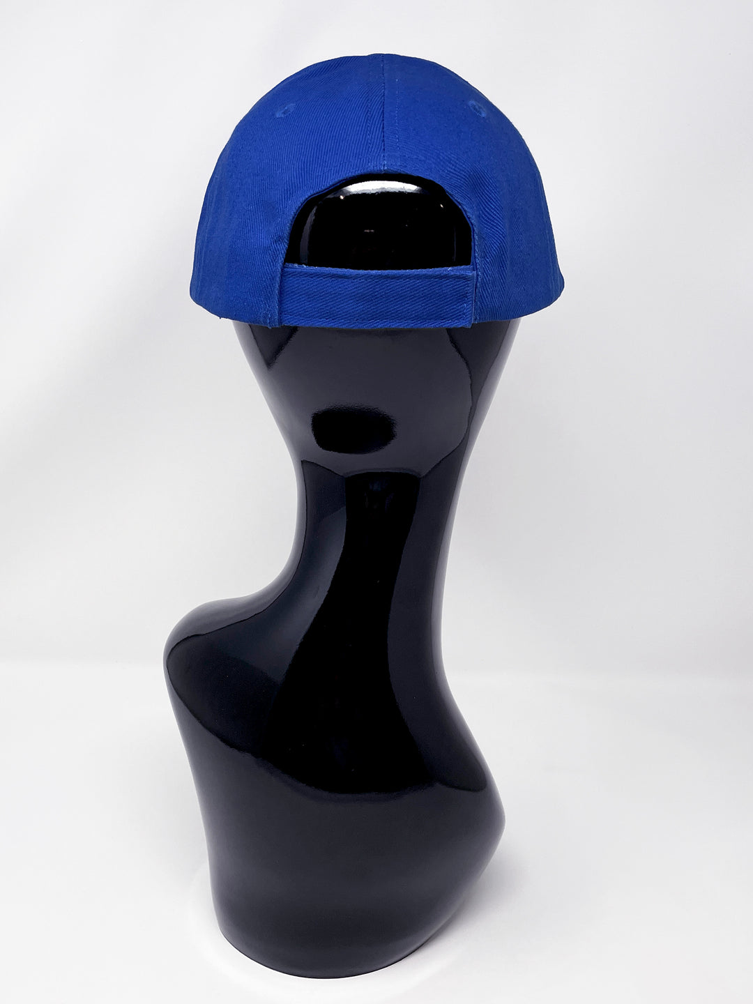 Blue curved peak cap with an embellished vibrant pink and blue glitter mix peak and 3D Jukebox logo emblem centre front, stylish streetwear, eye catching accessory, adjustable, velcro back, party hat, festival hat, urban, unique headwear, made in the UK