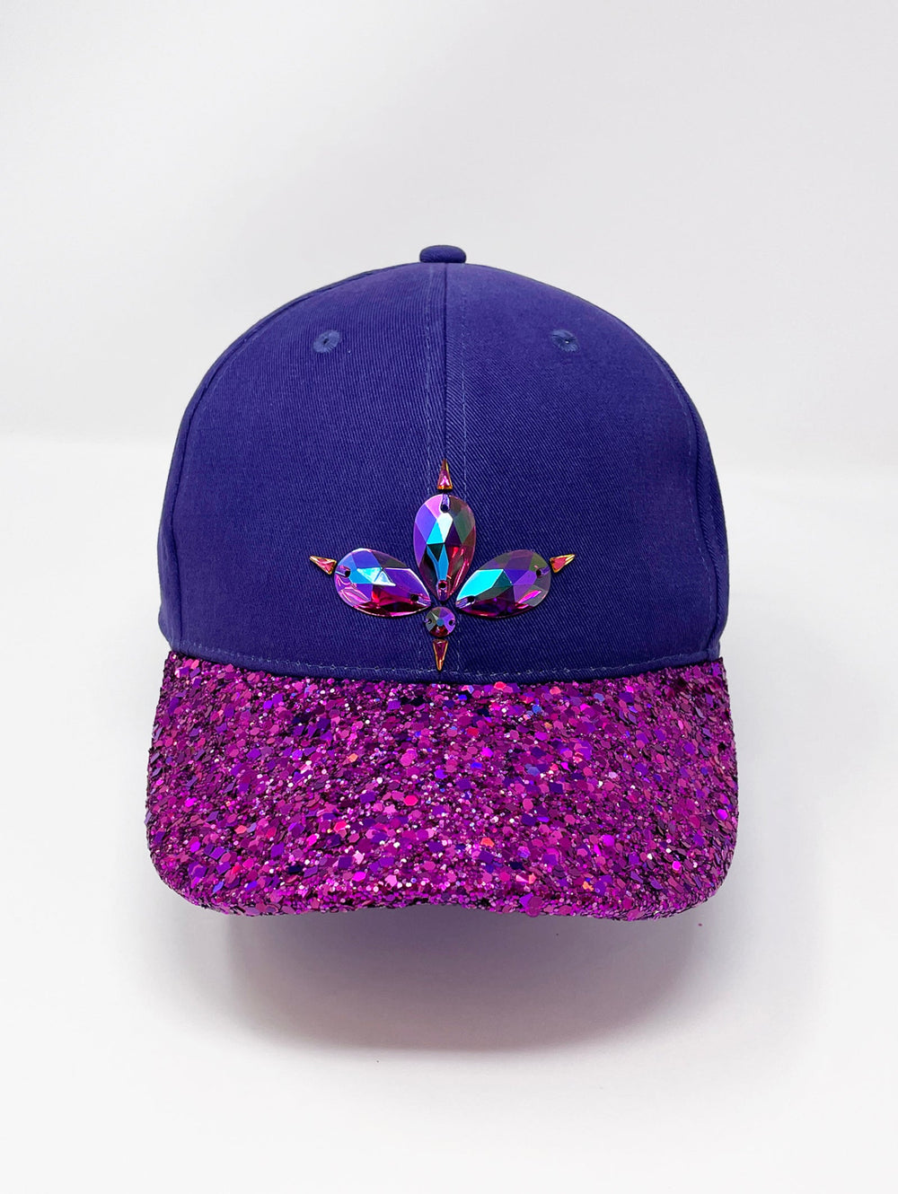 Purple curved peak cap with an embellished vibrant pink glitter mix peak and 3D Jukebox logo emblem centre front, stylish streetwear, eye catching accessory, adjustable, buckle back, party hat, festival hat, urban, unique headwear, made in the UK