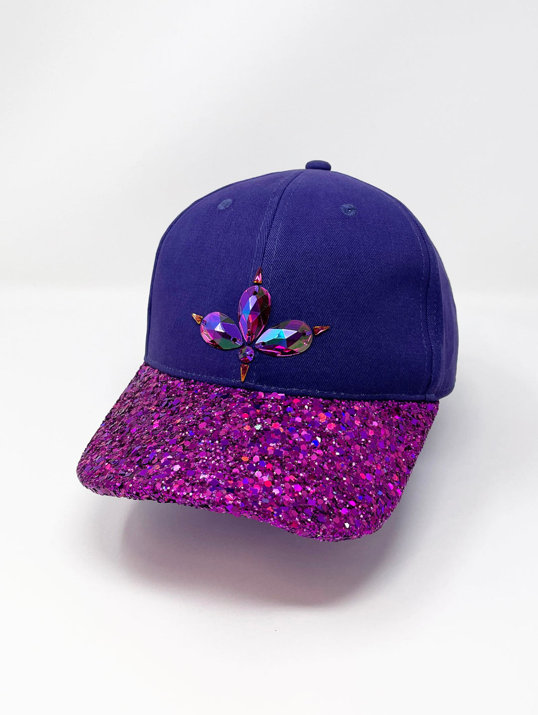Purple curved peak cap with an embellished vibrant pink glitter mix peak and 3D Jukebox logo emblem centre front, stylish streetwear, eye catching accessory, adjustable, buckle back, party hat, festival hat, urban, unique headwear, made in the UK