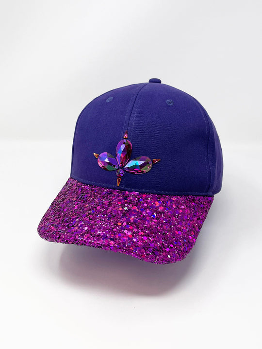 Purple curved peak cap with an embellished vibrant pink glitter mix peak and 3D Jukebox logo emblem centre front, stylish streetwear, eye catching accessory, adjustable, buckle back, party hat, festival hat, urban, unique headwear, made in the UK