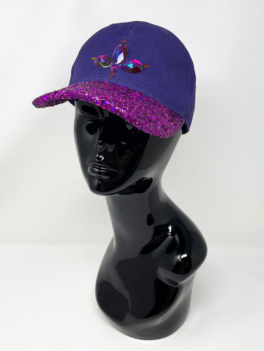 Purple curved peak cap with an embellished vibrant pink glitter mix peak and 3D Jukebox logo emblem centre front, stylish streetwear, eye catching accessory, adjustable, buckle back, party hat, festival hat, urban, unique headwear, made in the UK