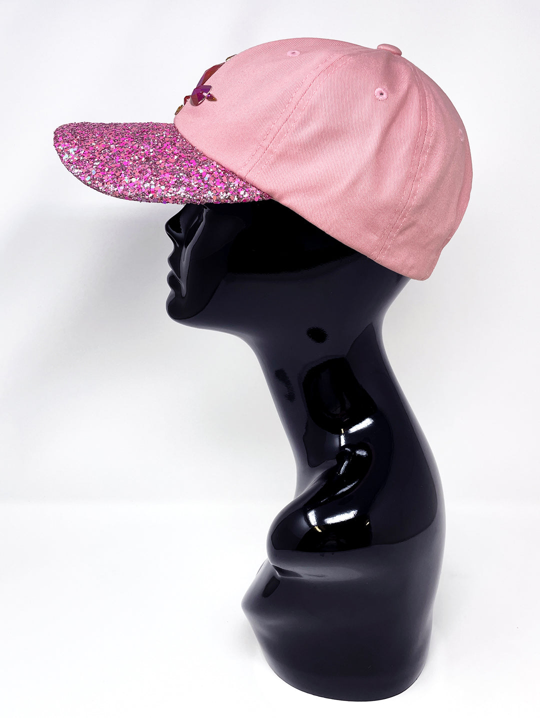 Light pink low profile cap with an embellished hot pink glitter mix peak and 3D Jukebox logo emblem centre front, stylish streetwear, eye catching accessory, buckle back, dusky pink, party hat, festival hat, urban, unique headwear, made in the UK