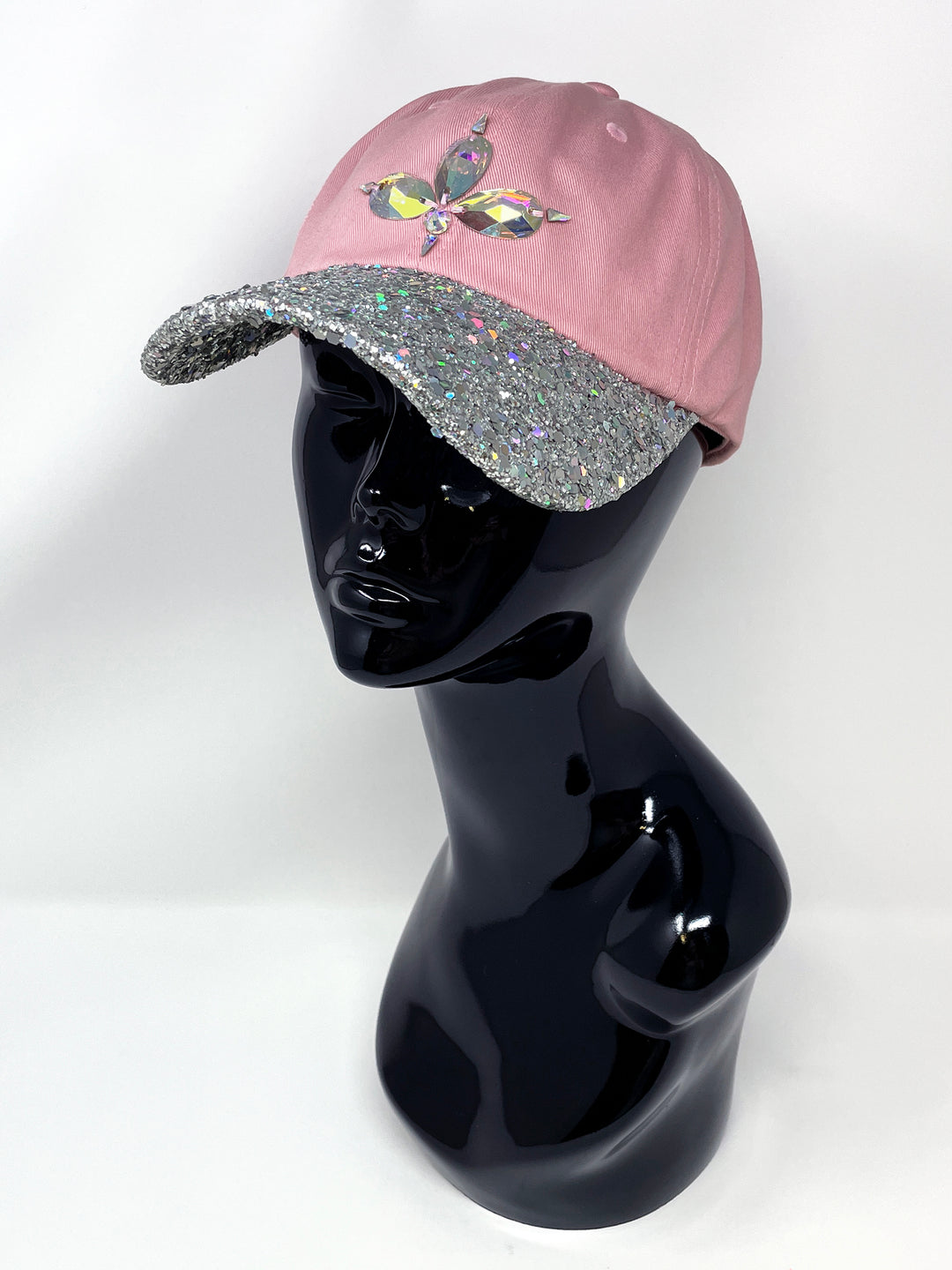 Light pink low profile cap with an embellished holographic silver glitter peak and 3D Jukebox logo emblem centre front, stylish streetwear, eye catching accessory, buckle back, iridescent, dusky pink, party hat, festival hat, urban