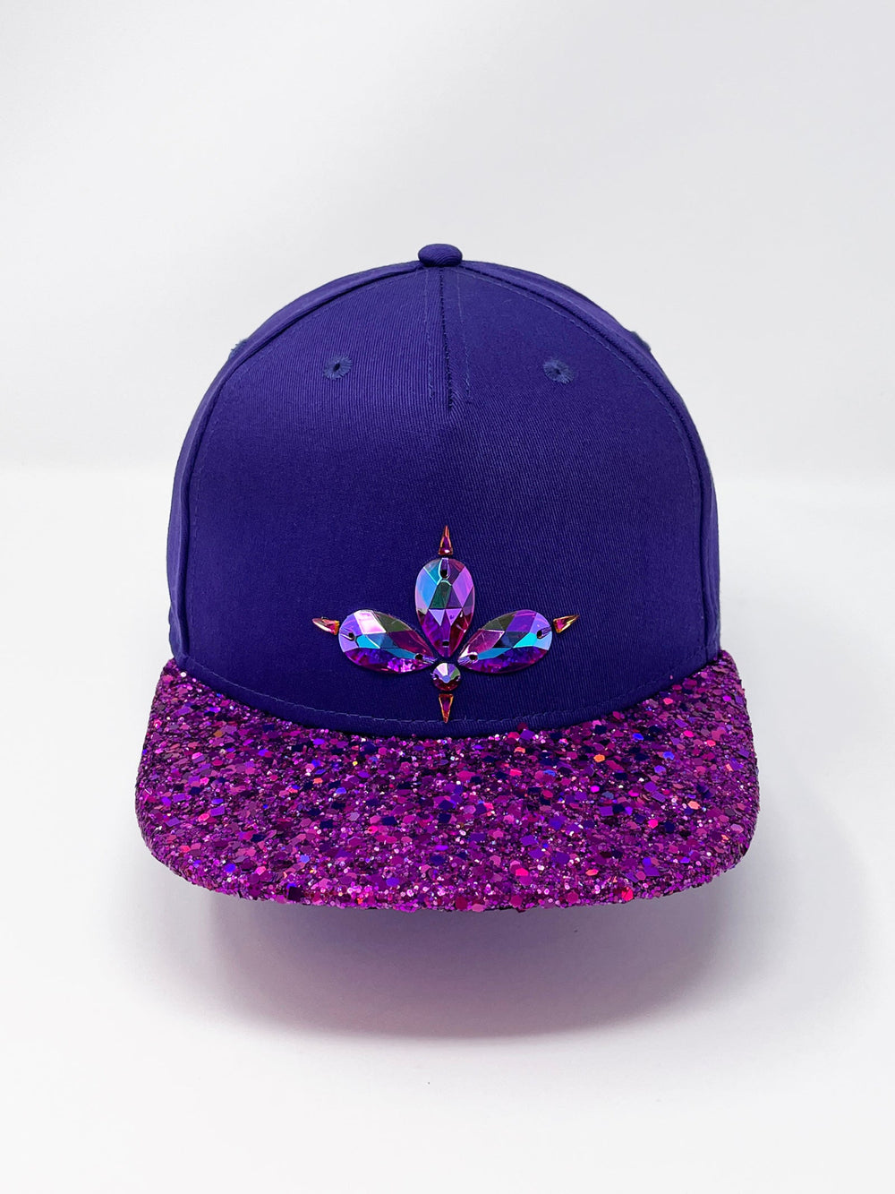 Purple flat peak cap with a vibrant pink chunky glitter peak. 3D Jukebox logo emblem centre front, stylish streetwear, eye catching accessory, adjustable, snapback, party hat, festival hat, rave, urban, crystals, festival fashion, glow, rhinestones, unique headwear, made in the UK