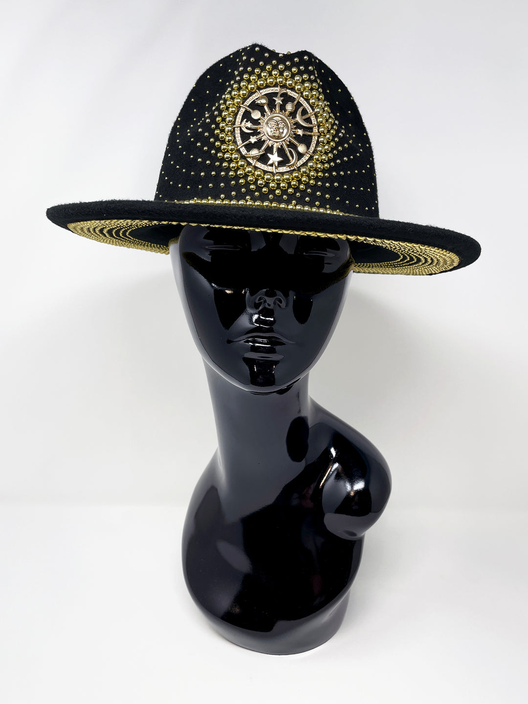 Short Brim black fedora hat with a gold metal sun and moon centre motif, embellished with a splash of gold pearl like rhinestones and crystals. gold splash, luxury fedora, made in the uk, handmade, statement hat, high end fashion, festival fedora, ibiza hat, festival outfit