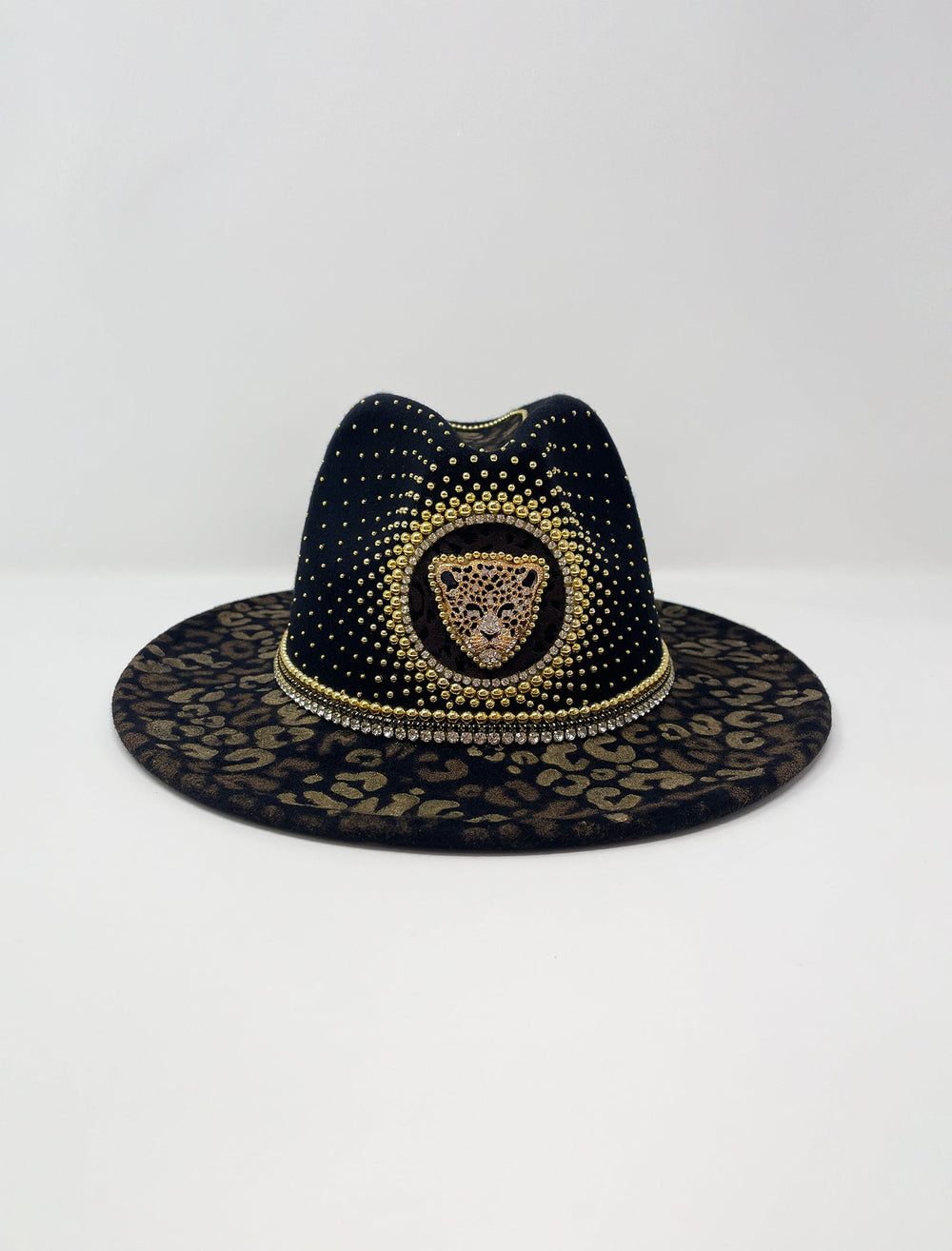 Short Brim black fedora hat, hand painted leopard print in metallic gold tones, with a gold metal and crystal leopard centre motif, embellished with gold pearl like rhinestones and crystals. gold splash, luxury fedora, made in the uk, handmade, statement hat, high end fashion, festival fedora, ibiza hat