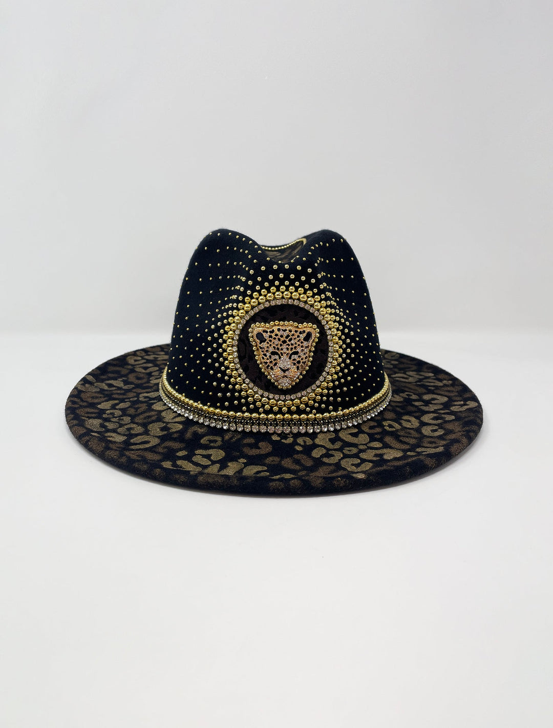 Short Brim black fedora hat, hand painted leopard print in metallic gold tones, with a gold metal and crystal leopard centre motif, embellished with gold pearl like rhinestones and crystals. gold splash, luxury fedora, made in the uk, handmade, statement hat, high end fashion, festival fedora, ibiza hat