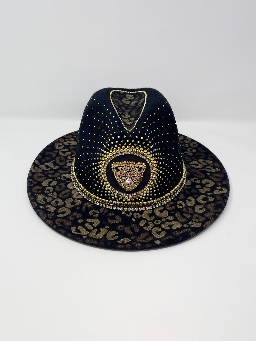 Short Brim black fedora hat, hand painted leopard print in metallic gold tones, with a gold metal and crystal leopard centre motif, embellished with gold pearl like rhinestones and crystals. gold splash, luxury fedora, made in the uk, handmade, statement hat, high end fashion, festival fedora, ibiza hat