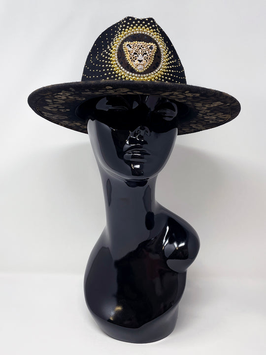 Short Brim black fedora hat, hand painted leopard print in metallic gold tones, with a gold metal and crystal leopard centre motif, embellished with gold pearl like rhinestones and crystals. gold splash, luxury fedora, made in the uk, handmade, statement hat, high end fashion, festival fedora, ibiza hat