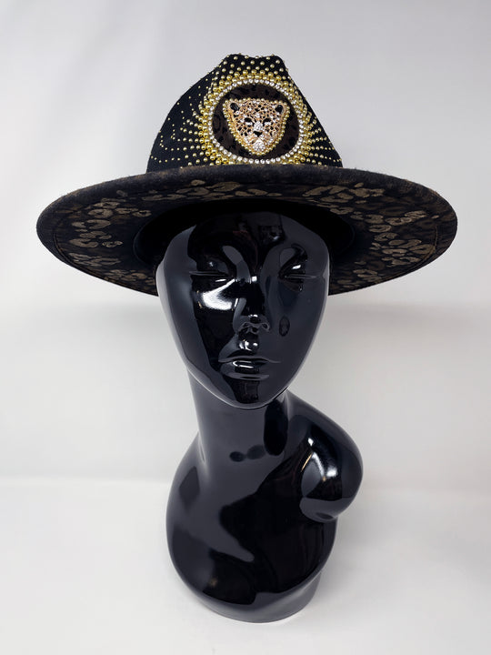 Short Brim black fedora hat, hand painted leopard print in metallic gold tones, with a gold metal and crystal leopard centre motif, embellished with gold pearl like rhinestones and crystals. gold splash, luxury fedora, made in the uk, handmade, statement hat, high end fashion, festival fedora, ibiza hat