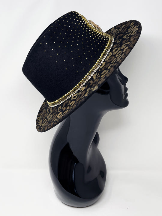 Short Brim black fedora hat, hand painted leopard print in metallic gold tones, with a gold metal and crystal leopard centre motif, embellished with gold pearl like rhinestones and crystals. gold splash, luxury fedora, made in the uk, handmade, statement hat, high end fashion, festival fedora, ibiza hat