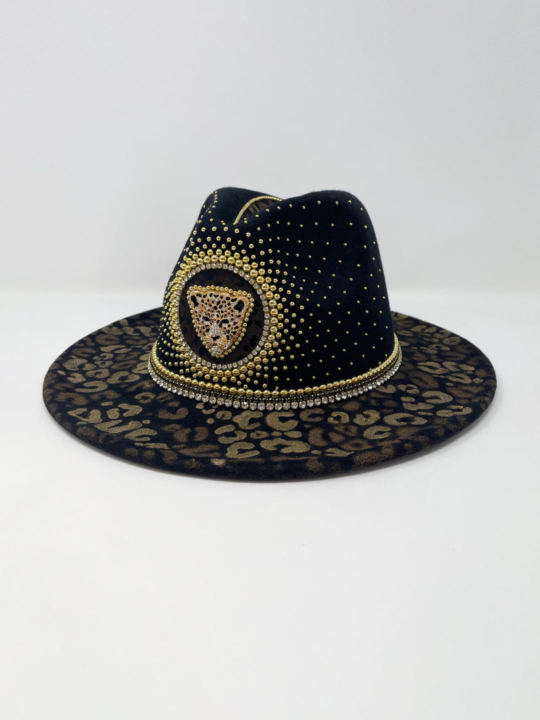 Short Brim black fedora hat, hand painted leopard print in metallic gold tones, with a gold metal and crystal leopard centre motif, embellished with gold pearl like rhinestones and crystals. gold splash, luxury fedora, made in the uk, handmade, statement hat, high end fashion, festival fedora, ibiza hat