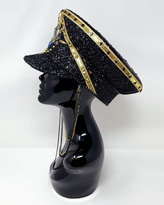 Black and Gold captain hat. Authentic up cycled military hat, fully lined, hand embellished with black glitter mix. Black gold flip sequin top, hand detailed with sequin trim, crystals and rhinestones. costume hat, festival hat, festival outfit, statement hat, high end hats, high end party wear, where to buy captain hats, stage wear, unique fashion, festival essentials, festival headwear, halloween, burning man hat, army hat, rave outfit, festival style, unique fashion, mermaid sequin, hats for rent
