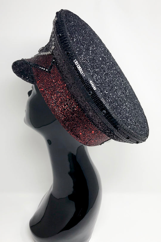 Black and red captain hat, Authentic up cycled military hat, fully lined, hand embellished with black and red glitter mix, beautifully hand detailed with black and red glitter faux leather, square sequin trim, crystals and rhinestones. costume hat, festival hat, festival outfit, statement hat, high end hats, high end party wear, where to buy captain hats, stage wear, unique fashion, custom stagewear, festival essentials, festival headwear, halloween outfit, burning man hat, army hat, made in the UK, rave