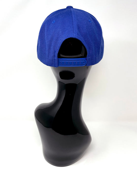 Blue flat peak cap with a gold and blue glitter mix peak. 3D Jukebox logo emblem centre front, stylish streetwear, eye catching accessory, adjustable, snapback, party hat, festival hat, rave, urban, crystals, festival fashion, rhinestones, unique headwear, made in the UK