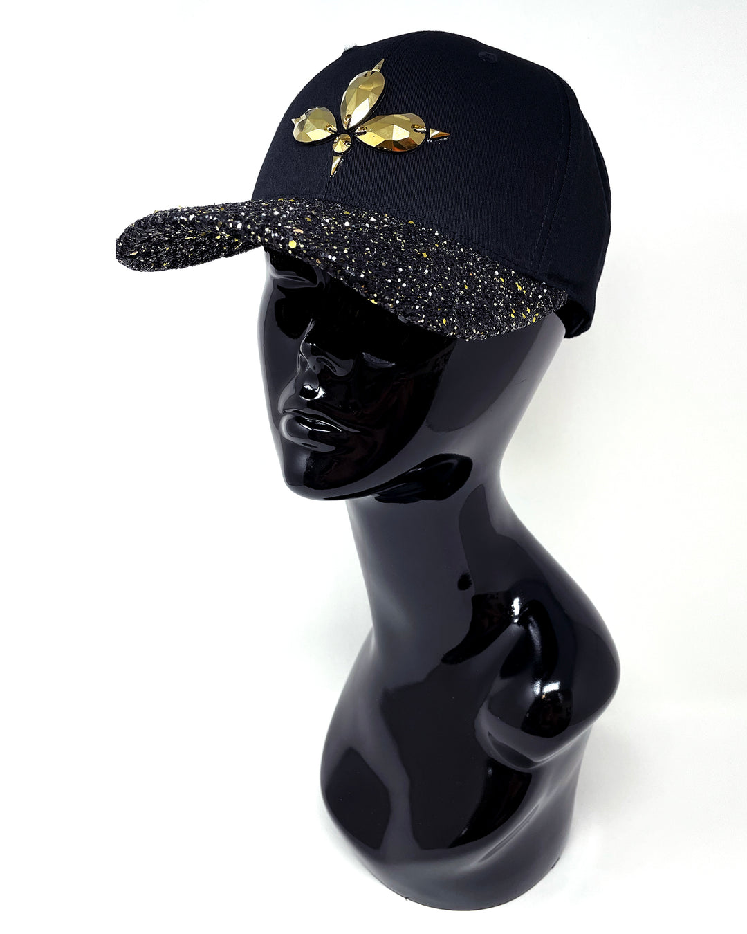 Black curved peak cap with a gold and black glitter mix peak. 3D Jukebox logo emblem centre front, stylish streetwear, eye catching accessory, adjustable, snapback, party hat, halloween, festival hat, rave, urban, crystals, rhinestones, unique headwear, made in the UK