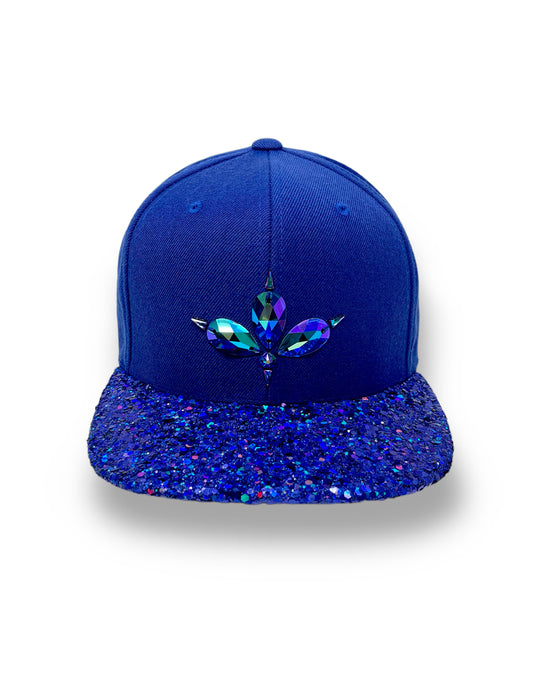 Blue flat peak cap with a blue chunky glitter peak. 3D Jukebox logo emblem centre front, stylish streetwear, eye catching accessory, adjustable, snapback, party hat, festival hat, rave, urban, crystals, Royal blue, electric blue, festival fashion, glow, rhinestones, unique headwear, made in the UK