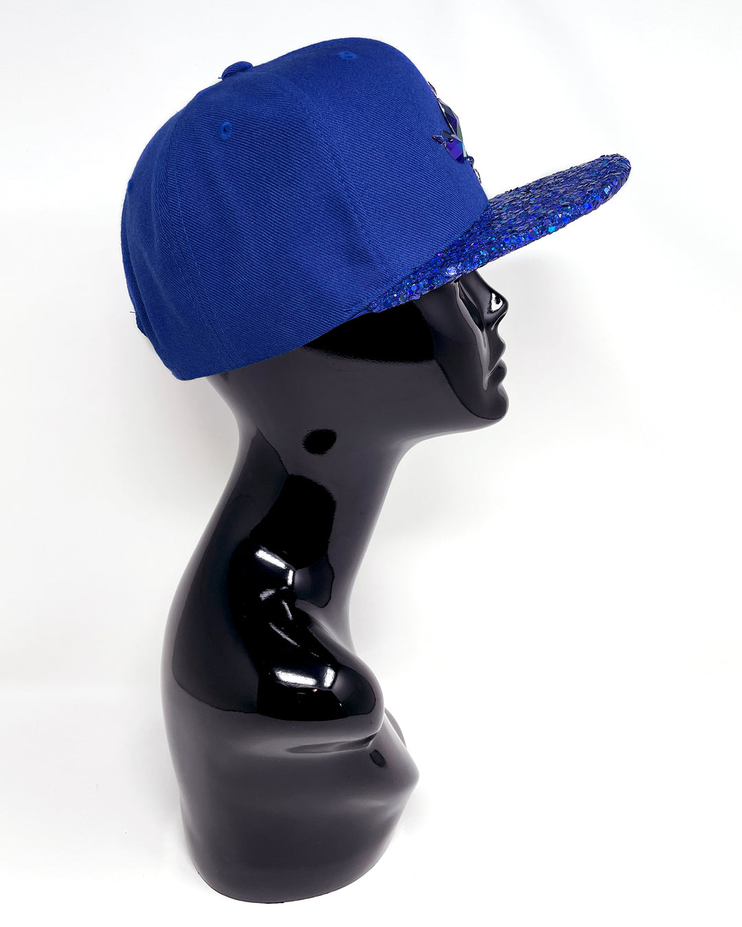 Blue flat peak cap with a blue chunky glitter peak. 3D Jukebox logo emblem centre front, stylish streetwear, eye catching accessory, adjustable, snapback, party hat, festival hat, rave, urban, crystals, Royal blue, electric blue, festival fashion, glow, rhinestones, unique headwear, made in the UK