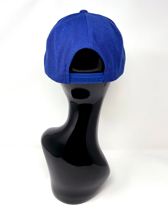 Blue flat peak cap with a blue chunky glitter peak. 3D Jukebox logo emblem centre front, stylish streetwear, eye catching accessory, adjustable, snapback, party hat, festival hat, rave, urban, crystals, Royal blue, electric blue, festival fashion, glow, rhinestones, unique headwear, made in the UK